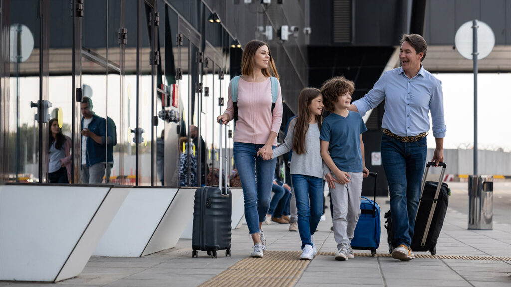 Loving family traveling together and looking happy arriving at the airport - travel concepts